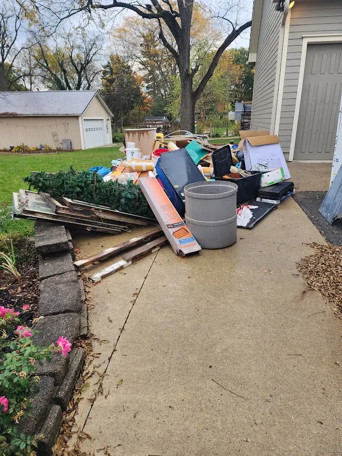Dumpster being loaded with debris for Commercial Dumpster Rental in Sequim